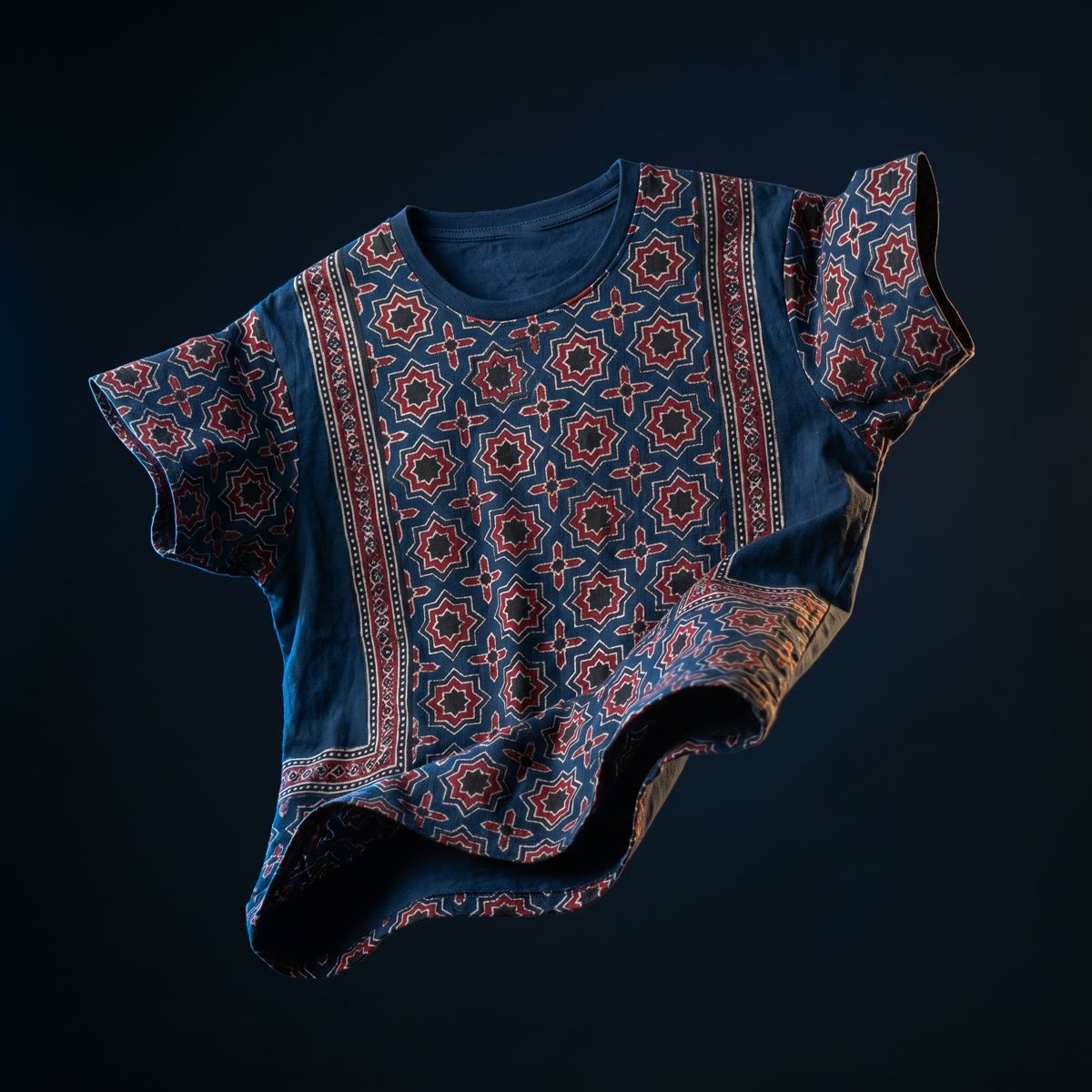 Drop 002, Ajrakh: Sitara, the eight-point star repeat, madder and undyed white on midnight indigo cotton.